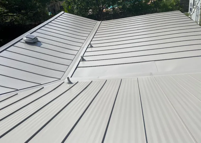 Solar attic fan installed on a metal roof for Roof Ventilation in Pigeon Forge